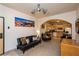 Inviting living room flows into an open kitchen with an archway and neutral decor at 223 Hunter Ridge Rd # 300, Brian Head, UT 84719