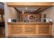 Reception desk featuring carved relief and warm, natural lighting at 223 Hunter Ridge Rd # 300, Brian Head, UT 84719