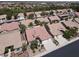 An aerial view of a home with a red tile roof in a manicured community at 2251 Summerwind Cir, Henderson, NV 89052