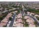 Wide aerial view shows neighborhood layout, landscaping, and community amenities at 2251 Summerwind Cir, Henderson, NV 89052