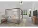 Bright bedroom featuring a four-poster bed, neutral decor and ample natural light at 2251 Summerwind Cir, Henderson, NV 89052