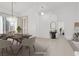Open concept dining room featuring modern chandelier and stylish furniture at 2251 Summerwind Cir, Henderson, NV 89052