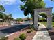 A view of the Enclave entrance with mature trees and manicured landscaping at 2251 Summerwind Cir, Henderson, NV 89052