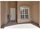 Charming front porch with inviting welcome mat and decorative sidelight windows at 2251 Summerwind Cir, Henderson, NV 89052