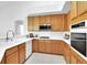 Well-maintained kitchen with stainless steel appliances, ample cabinet space, and white countertops at 2251 Summerwind Cir, Henderson, NV 89052