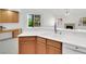 Bright kitchen area with an open layout, modern appliances, and breakfast bar seating at 2251 Summerwind Cir, Henderson, NV 89052
