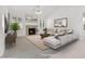 Cozy living room with fireplace, bright windows, and comfortable sectional sofa at 2251 Summerwind Cir, Henderson, NV 89052