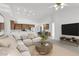 Spacious living area with open floor plan, comfortable seating, and stylish decor at 2251 Summerwind Cir, Henderson, NV 89052