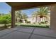 Covered patio provides a charming outdoor space with views of the landscaped backyard at 2251 Summerwind Cir, Henderson, NV 89052