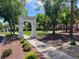 The Enclave entrance with manicured landscaping and mature trees at 2251 Summerwind Cir, Henderson, NV 89052
