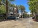 Picturesque street view with storefronts, palm trees, and parked cars creating a vibrant atmosphere at 2251 Summerwind Cir, Henderson, NV 89052