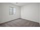 Cozy carpeted bedroom with a window providing natural light at 2636 Lily Point St, Las Vegas, NV 89156