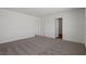 Spacious carpeted room with multiple doors and neutral wall color at 2636 Lily Point St, Las Vegas, NV 89156