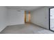 Bright bedroom with neutral carpet, fresh paint, and a sliding glass door at 2681 Ruthe Duarte Ave, Las Vegas, NV 89121