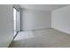 Bright bedroom with neutral carpet, tile accent, sliding glass door, and freshly painted walls at 2681 Ruthe Duarte Ave, Las Vegas, NV 89121