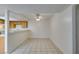 The dining room offers neutral walls, tile flooring, and modern ceiling fan with access to the kitchen at 2681 Ruthe Duarte Ave, Las Vegas, NV 89121
