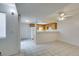 An open kitchen features tile floors, wooden cabinets, white appliances, and a breakfast bar area at 2681 Ruthe Duarte Ave, Las Vegas, NV 89121