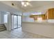 The kitchen offers tile flooring, breakfast bar, white appliances and slider door access to a patio at 2681 Ruthe Duarte Ave, Las Vegas, NV 89121