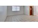 Spacious living room boasting large windows, neutral walls, and tile flooring at 2681 Ruthe Duarte Ave, Las Vegas, NV 89121
