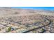 Expansive aerial view showcases a well-planned community with desert landscaping, wide streets, and mountain views at 2727 Chinaberry Hill St, Laughlin, NV 89029