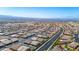 Expansive aerial view showcases a well-planned community with desert landscaping, wide streets, and mountain views at 2727 Chinaberry Hill St, Laughlin, NV 89029