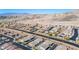 Expansive aerial view showcases a well-planned community with desert landscaping, wide streets, and mountain views at 2727 Chinaberry Hill St, Laughlin, NV 89029
