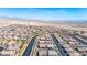 Expansive aerial view showcases a well-planned community with desert landscaping, wide streets, and mountain views at 2727 Chinaberry Hill St, Laughlin, NV 89029