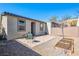 Low maintenance backyard featuring a paver patio, gravel landscaping, raised planting beds, and privacy fencing at 2727 Chinaberry Hill St, Laughlin, NV 89029