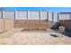 Backyard featuring a paver patio, gravel landscaping, raised planting beds, and privacy fencing at 2727 Chinaberry Hill St, Laughlin, NV 89029