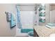 Bathroom featuring a shower-tub combination, granite counters and floating shelves for convenient towel storage at 2727 Chinaberry Hill St, Laughlin, NV 89029