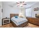 Cozy bedroom with a ceiling fan, decorative tile floors, and a comfortable bed at 2727 Chinaberry Hill St, Laughlin, NV 89029