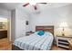Comfortable bedroom features unique floors, a ceiling fan, and ensuite bathroom access at 2727 Chinaberry Hill St, Laughlin, NV 89029