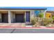 Charming townhouse with a one-car garage and landscaped front, offering a welcoming curb appeal at 2727 Chinaberry Hill St, Laughlin, NV 89029