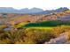 Scenic desert golf course featuring lush green fairways and rugged desert landscape under a bright sky at 2727 Chinaberry Hill St, Laughlin, NV 89029