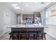 A well-lit kitchen with a granite-topped island, stainless steel appliances, and bar stool seating at 2727 Chinaberry Hill St, Laughlin, NV 89029
