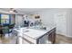 Spacious kitchen island featuring granite counters, a stainless steel sink and seating for dining at 2727 Chinaberry Hill St, Laughlin, NV 89029