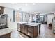 Open kitchen boasts granite counters, stainless appliances, and transitions to the living area at 2727 Chinaberry Hill St, Laughlin, NV 89029
