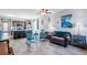 Open-concept living room and kitchen with tile floors, ceiling fan, and seamless flow for entertaining at 2727 Chinaberry Hill St, Laughlin, NV 89029