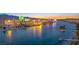 Night river view showcasing illuminated city lights and riverside casinos, reflecting the vibrant nightlife and waterfront scenery at 2727 Chinaberry Hill St, Laughlin, NV 89029