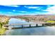 Picturesque scene of a bridge spanning a serene river, framed by desert landscapes and a clear, sunny sky at 2727 Chinaberry Hill St, Laughlin, NV 89029