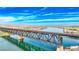 Scenic river vista featuring a railway bridge under a bright sky, with the calm water reflecting the daytime sky at 2727 Chinaberry Hill St, Laughlin, NV 89029