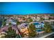 Expansive community view featuring a home with solar panels and a private backyard pool at 2749 Carolina Blue Ave, Henderson, NV 89052