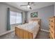 Bright bedroom with soft carpet, natural wood furniture, white linens, and plenty of natural light at 2749 Carolina Blue Ave, Henderson, NV 89052