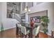 Elegant dining room with high ceilings, modern chandelier, dark wood table, and staircase access at 2749 Carolina Blue Ave, Henderson, NV 89052