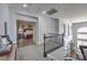 Upstairs hallway with views into the living room and bedroom at 2749 Carolina Blue Ave, Henderson, NV 89052