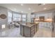 Well-lit kitchen featuring an island, granite countertops, and stainless steel appliances at 2749 Carolina Blue Ave, Henderson, NV 89052