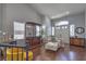 Inviting living area with hardwood floors, comfortable seating, and a charming bar area at 2749 Carolina Blue Ave, Henderson, NV 89052