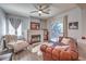 Charming living room with a fireplace, comfortable seating, and plenty of natural light at 2749 Carolina Blue Ave, Henderson, NV 89052