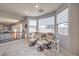 Inviting sitting area featuring comfortable chairs, natural light from windows, and views of the surrounding landscape at 2749 Carolina Blue Ave, Henderson, NV 89052