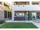 Beautifully landscaped backyard features an outdoor kitchen and comfortable seating areas at 286 Shaded Canyon Dr, Henderson, NV 89012